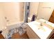 Functional bathroom with white fixtures, a shower/tub, and essential amenities at 35077 Whispering Oaks Blvd, Dade City, FL 33523