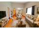 Warm and inviting living room with hardwood floors and comfortable seating at 35077 Whispering Oaks Blvd, Dade City, FL 33523