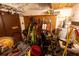 Storage room featuring water heater, shelving, and pegboard for tools at 35077 Whispering Oaks Blvd, Dade City, FL 33523