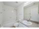 Bright bathroom with tile flooring, bathtub with shower, and vanity at 38237 Eucalyptus Dr, Zephyrhills, FL 33542