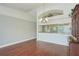Bright dining room with hardwood floors, view to kitchen and unique architectural details at 38237 Eucalyptus Dr, Zephyrhills, FL 33542