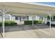 The property has a parking area adjacent to the home and lots of decorative plants at 38237 Eucalyptus Dr, Zephyrhills, FL 33542