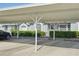 The property has a parking area adjacent to the home and decorative plants at 38237 Eucalyptus Dr, Zephyrhills, FL 33542