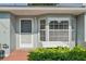 Inviting front entrance featuring a bay window and neat landscaping that enhances the home's curb appeal at 38237 Eucalyptus Dr, Zephyrhills, FL 33542