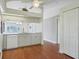 Breakfast nook off kitchen with white cabinets, appliances, and access to outside at 38237 Eucalyptus Dr, Zephyrhills, FL 33542