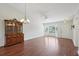 Bright living room with hardwood floors, a ceiling fan, and a bright bay window providing natural light at 38237 Eucalyptus Dr, Zephyrhills, FL 33542