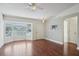 Hardwood flooring and natural light in this comfortable living room space featuring a ceiling fan at 38237 Eucalyptus Dr, Zephyrhills, FL 33542