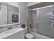 Bathroom featuring tile backsplash, vanity and mirror with combination tub and shower at 4215 E Bay Dr # 1706A, Clearwater, FL 33764