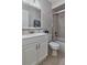 Bathroom featuring tile backsplash, vanity and mirror with combination tub and shower at 4215 E Bay Dr # 1706A, Clearwater, FL 33764