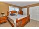 Bedroom featuring a wooden bed frame, coordinating dresser, and double door closet at 4215 E Bay Dr # 1706A, Clearwater, FL 33764