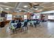 A spacious common area with tables, chairs, TV, fireplace and pool table for resident enjoyment at 4215 E Bay Dr # 1706A, Clearwater, FL 33764