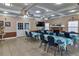 Inviting common area with neutral walls and tile floors, tables, fireplace and tv, perfect for gatherings at 4215 E Bay Dr # 1706A, Clearwater, FL 33764