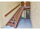 Exterior condo entrance featuring stairs leading up to the units and well-maintained landscaping at 4215 E Bay Dr # 1706A, Clearwater, FL 33764
