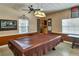 Game room featuring a pool table with brown covering, ceiling fan, and decor at 4215 E Bay Dr # 1706A, Clearwater, FL 33764