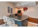 Basement game room featuring a bar area with seating and memorabilia at 4215 E Bay Dr # 1706A, Clearwater, FL 33764