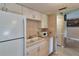 Functional kitchen with white appliances, ample counter space, and tile flooring at 4215 E Bay Dr # 1706A, Clearwater, FL 33764