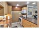 Kitchen featuring wooden cabinets, stainless steel appliances, and tiled backsplash at 4215 E Bay Dr # 1706A, Clearwater, FL 33764