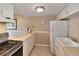 Well-maintained kitchen with white cabinets, countertops, and modern appliances at 4215 E Bay Dr # 1706A, Clearwater, FL 33764