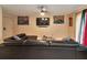 Comfortable living room with a leather sectional sofa, and stylish decor at 4215 E Bay Dr # 1706A, Clearwater, FL 33764