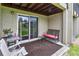 Cozy covered patio area with comfortable seating and a view of the lush greenery, perfect for relaxation at 4215 E Bay Dr # 1706A, Clearwater, FL 33764