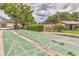 Outdoor shuffleboard courts nestled amid a community with lush greenery and mature trees at 4215 E Bay Dr # 1706A, Clearwater, FL 33764