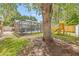 Backyard view features a screened pool and a play set at 4613 Summerwind Ct, Plant City, FL 33566