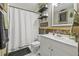 Unique bathroom featuring white vanity, shiplap, and rustic decor at 4613 Summerwind Ct, Plant City, FL 33566