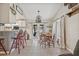 Bright dining area featuring an elegant light fixture and access to the backyard at 4613 Summerwind Ct, Plant City, FL 33566
