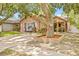A charming single-story house with brick accents, a cozy front porch and a concrete driveway at 4613 Summerwind Ct, Plant City, FL 33566