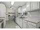 Bright kitchen with stainless steel refrigerator and ample cabinet storage space at 4613 Summerwind Ct, Plant City, FL 33566