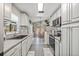 Bright kitchen with a sink, cabinets, microwave, and oven at 4613 Summerwind Ct, Plant City, FL 33566