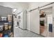 Efficient kitchen featuring modern appliances, ample storage, and convenient access via a sliding barn door at 4613 Summerwind Ct, Plant City, FL 33566