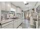 Spacious kitchen featuring a sink, dining area, and natural light at 4613 Summerwind Ct, Plant City, FL 33566