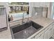 Close-up of the kitchen sink overlooking the backyard pool area at 4613 Summerwind Ct, Plant City, FL 33566