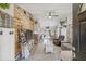 Inviting living room features a wood wall, TV, ceiling fan and stylish decor at 4613 Summerwind Ct, Plant City, FL 33566