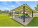 A covered picnic area with several tables at 4613 Summerwind Ct, Plant City, FL 33566