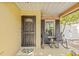 Welcoming front porch featuring cozy seating, ideal for enjoying morning coffee or evening chats at 4613 Summerwind Ct, Plant City, FL 33566
