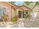 Inviting front porch with beautiful landscaping, perfect for relaxing and enjoying the outdoors at 4613 Summerwind Ct, Plant City, FL 33566