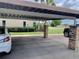 Well-maintained carport area with lush landscaping and convenient parking at 4712 Marine Pkwy # 203, New Port Richey, FL 34652