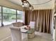 Inviting dining room with decorative lighting, and neutral tones creating a relaxing ambiance at 4712 Marine Pkwy # 203, New Port Richey, FL 34652