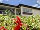 Inviting condo featuring private balcony and lush landscaping at 4712 Marine Pkwy # 203, New Port Richey, FL 34652