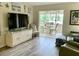 Bright living room with view to dining area and beach-themed decor at 4712 Marine Pkwy # 203, New Port Richey, FL 34652