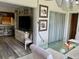 Open floor plan showcasing living room flowing into kitchen and dining area at 4712 Marine Pkwy # 203, New Port Richey, FL 34652