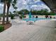 Relaxing pool area with ample seating and a clean, well-maintained pool at 4712 Marine Pkwy # 203, New Port Richey, FL 34652