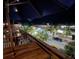 Charming downtown street scene at night with palm trees and lighted buildings at 4712 Marine Pkwy # 203, New Port Richey, FL 34652