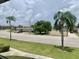 Scenic street view featuring palm trees, well-maintained landscaping, and glimpses of the surrounding neighborhood at 4712 Marine Pkwy # 203, New Port Richey, FL 34652