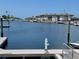 Picturesque waterfront view featuring docks, calm water, and waterfront condos at 4712 Marine Pkwy # 203, New Port Richey, FL 34652
