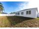 Spacious backyard features well kept grass, a white fence and the home's exterior at 5017 46Th W St, Bradenton, FL 34210
