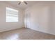 Cozy bedroom featuring tiled flooring, closet, and natural light from the window at 5017 46Th W St, Bradenton, FL 34210