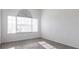 Bright bedroom featuring tile flooring, a blind-covered window, and neutral colored walls at 5017 46Th W St, Bradenton, FL 34210